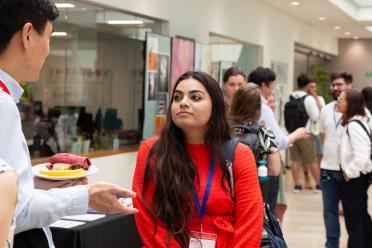 Delegates networking during the symposium