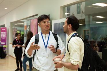 Delegates networking during the symposium