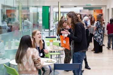 Colleagues networking during the last student symposium