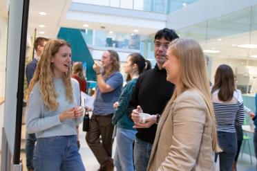 Colleagues networking during the last student symposium