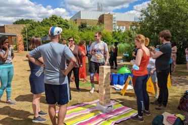 Staff taking part in sports day activities in June 2022