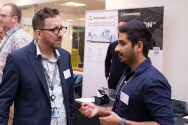 PhD researcher Yash Bancil networking during the symposium