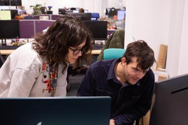 Dr Sonia Fonseca and Dr James Wilsenach looking at a screen together