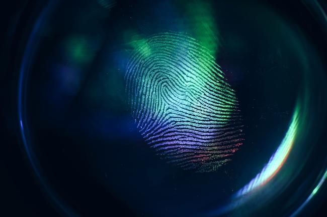 Close up of a fingerprint against black background